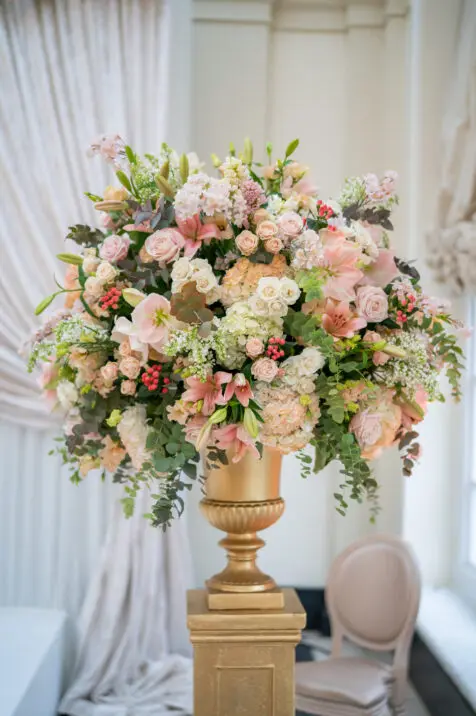 Floral display for luxury wedding colour scheme peach fuzz
