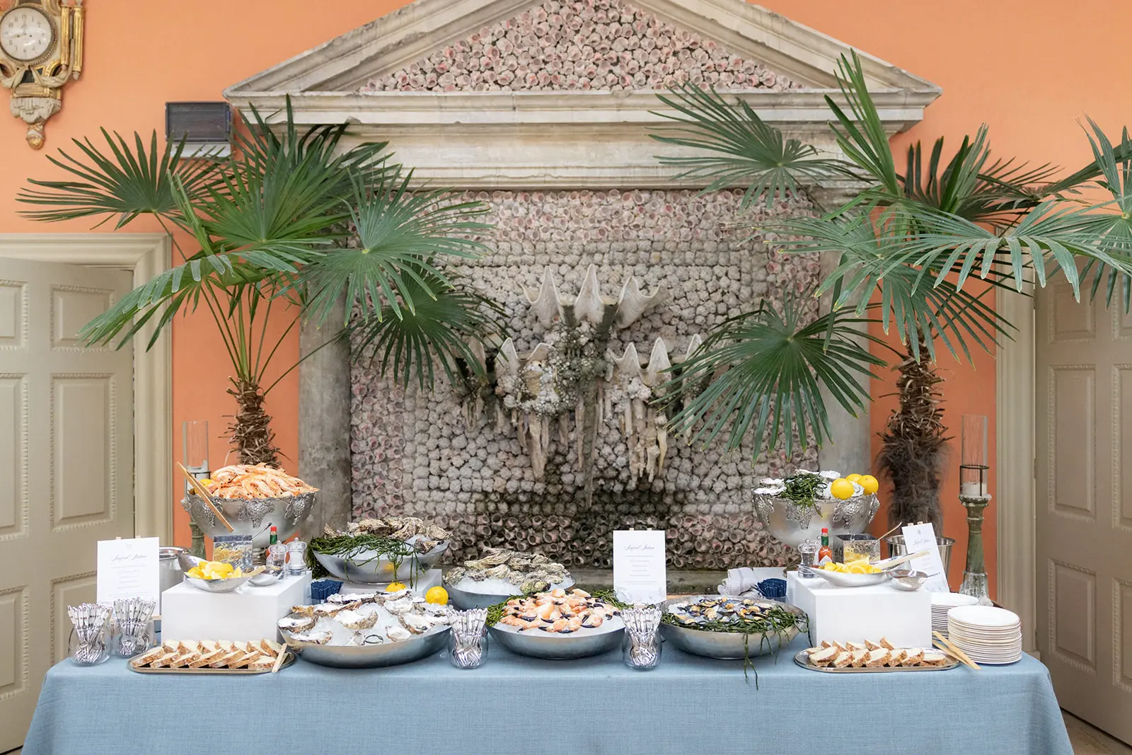 Seafood station set up in front of shell water feature | Hannah Hope Events | Uk Luxury Event Planner
