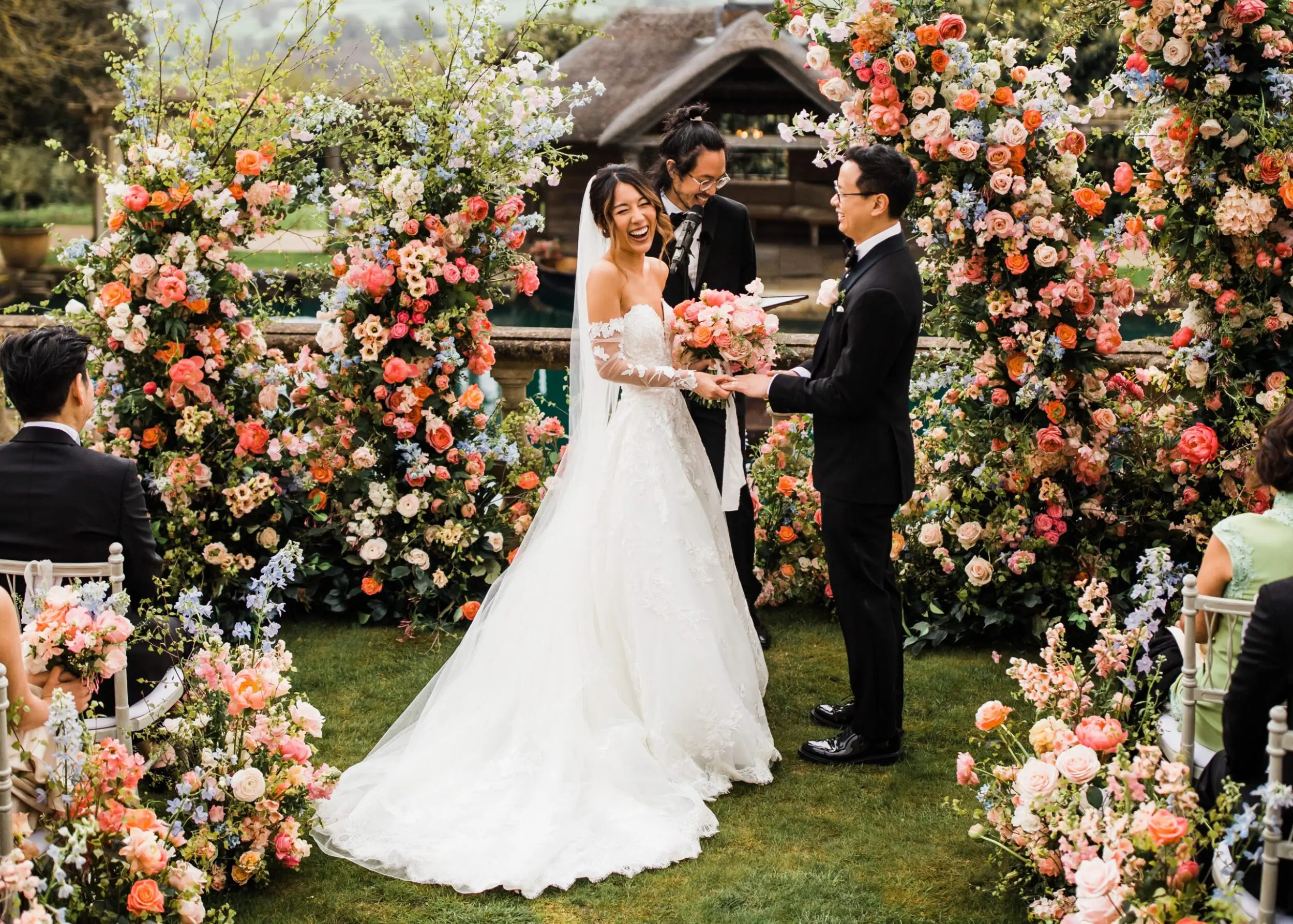 Bride & Groom laughing at spring wedding ceremony | Wedding Designer