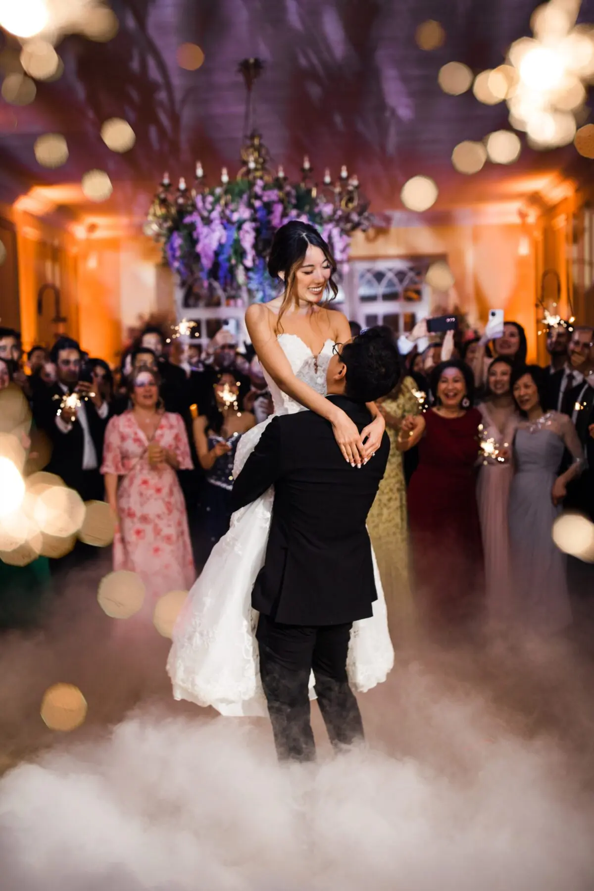 confetti cannons over bride and grooms first dance with low fog - wedding designer