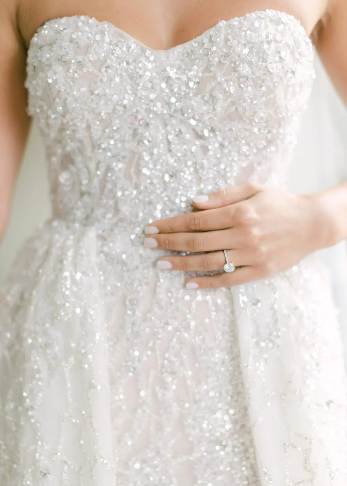Close up of brides bespoke berta wedding dress and engagement ring - Luxury wedding and events planner