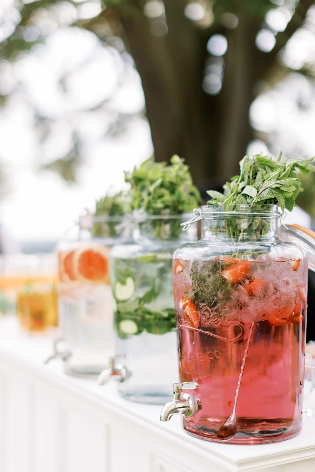 Hedsor House wedding Planner - three urns on bar with flavoured waters