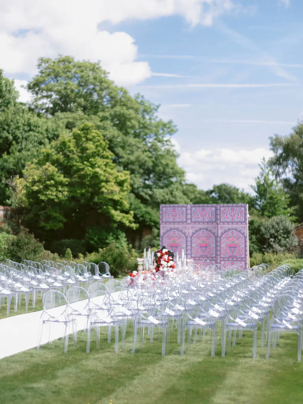 Sofreh Aghd ceremony set up at Four Seasons with clear ghost chairs