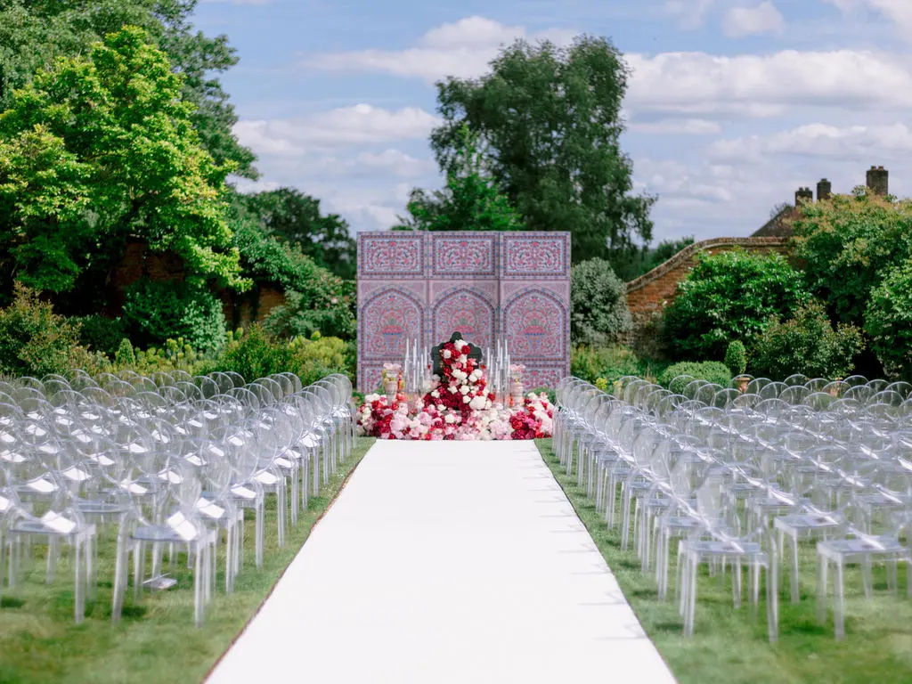 Sofreh Aghd ceremony set up at Four Seasons with clear ghost chairs - Vogue wedding feature