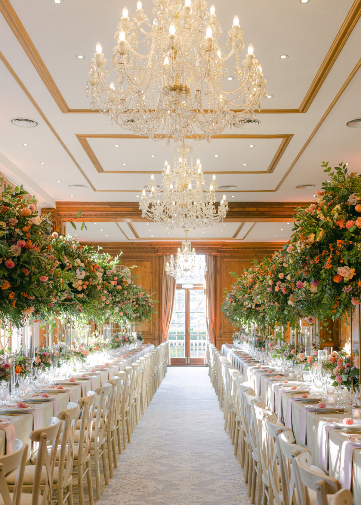 two tables dressed in huge autumn inspired floral displays - Buckinghamshire wedding