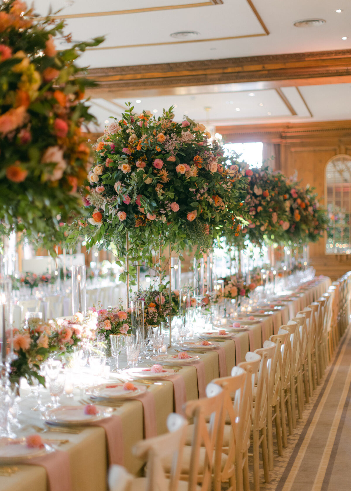 two tables dressed in huge autumn inspired floral displays - Buckinghamshire wedding