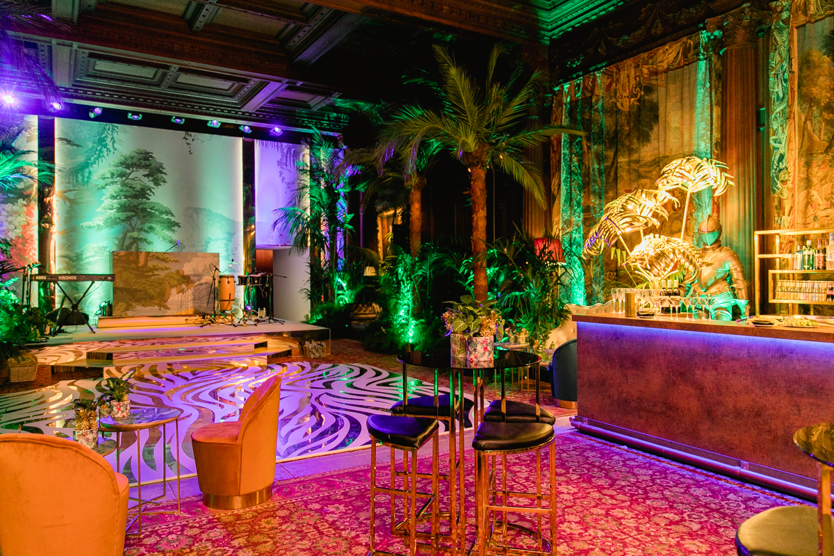 zebra gold and white dance floor surrounded in trees and green lighting
