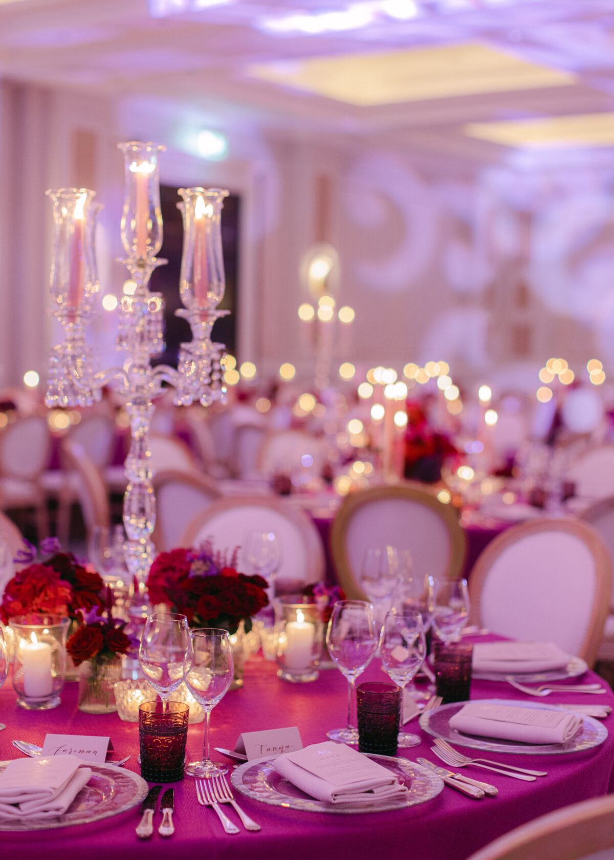 Luxury Weddings & Events Planner ballroom image pink, red and purple theming and flowers