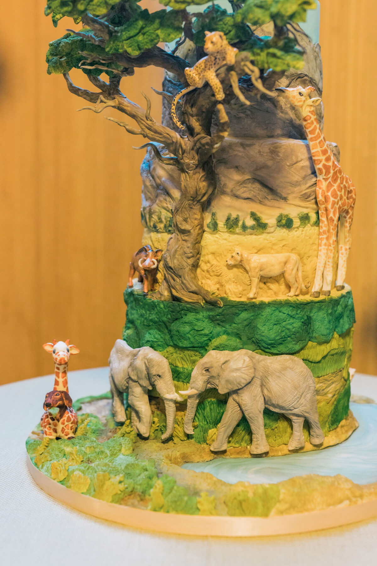 Close up of safari jungle themed 3 tiered cake | Luxury event planner