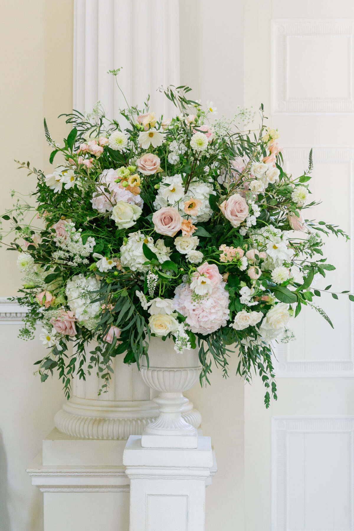 floral urn with pink, green and white florals - Syon Park Wedding
