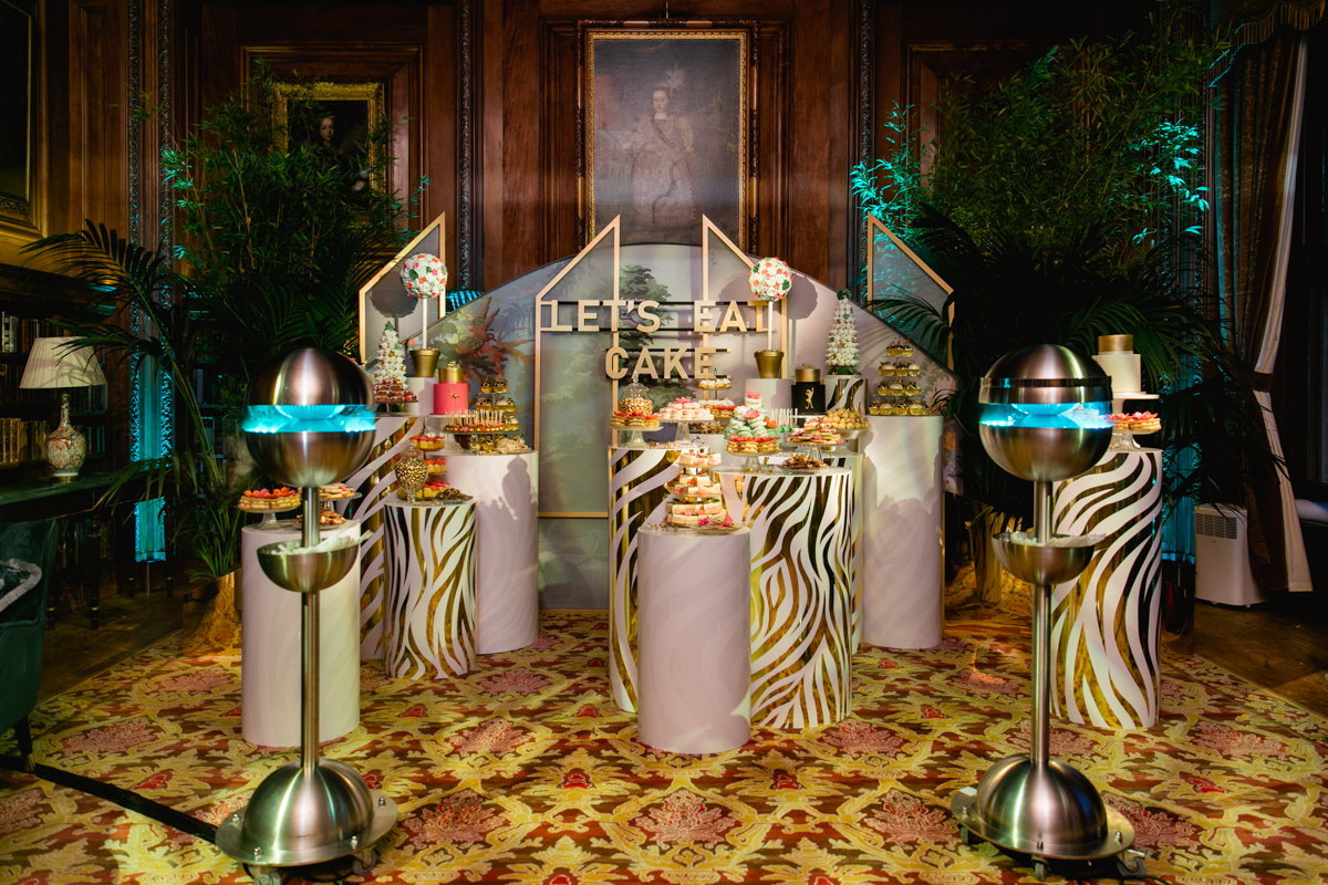 Safari themed dessert station with Lets eat cake light up sign on the backdrop | Hannah Hope Events | Uk Luxury Event Planner